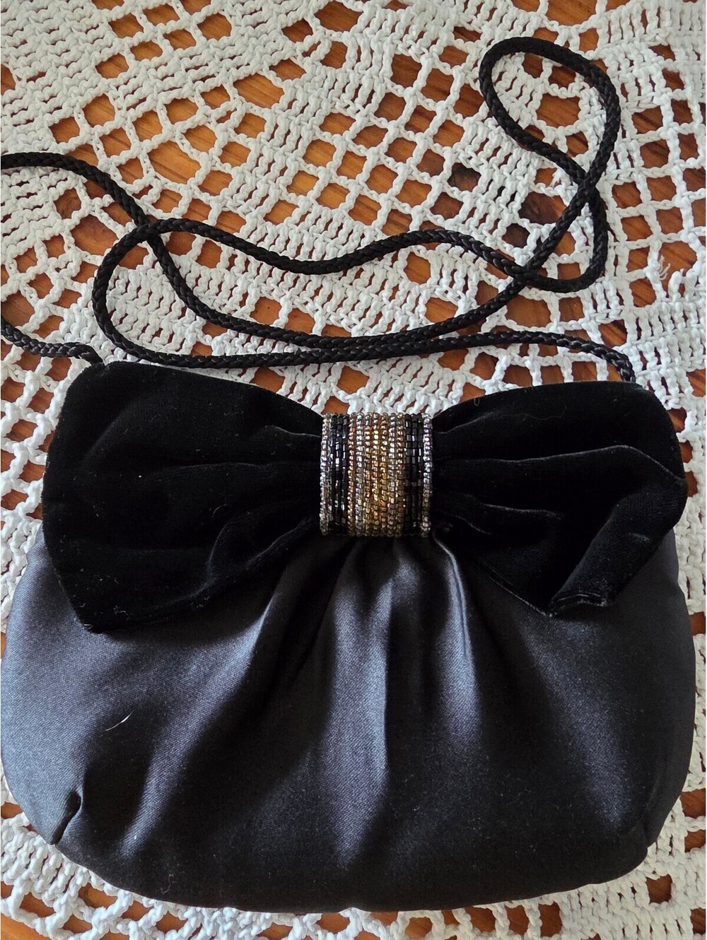 Elegant Black Satin Evening Bag with Beaded Bow Accent and Shoulder Strap